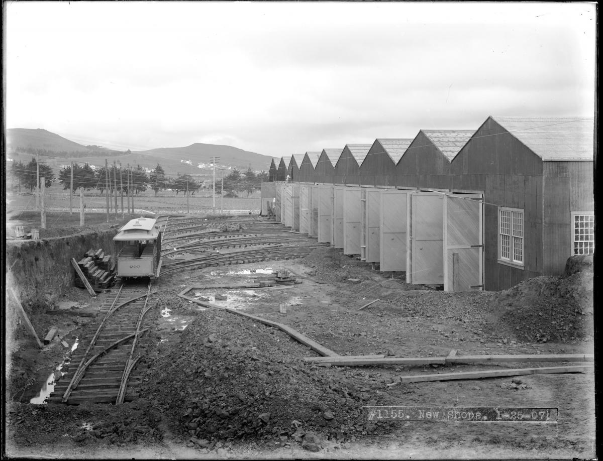 A lone cable car sits on a muddy ladder track outside the newly built Elkton Shops in this January 1907 shot.