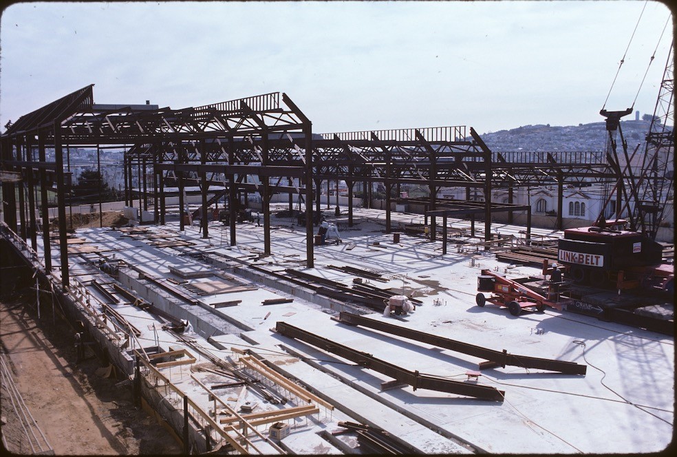 Construction progress on Muni Metro Center in November 1975 shows the main structure of the building taking shape.