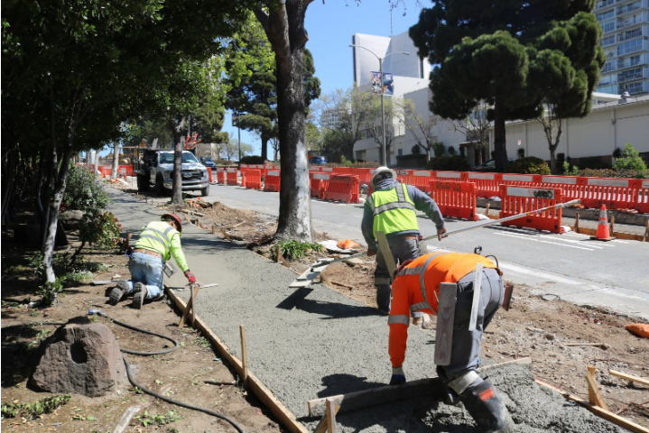 Esquivel Grading and Paving crew members pouring concrete along sidewalk at Geary Boulevard at Laguna. Photo courtesy of Esquivel Grading and Paving     