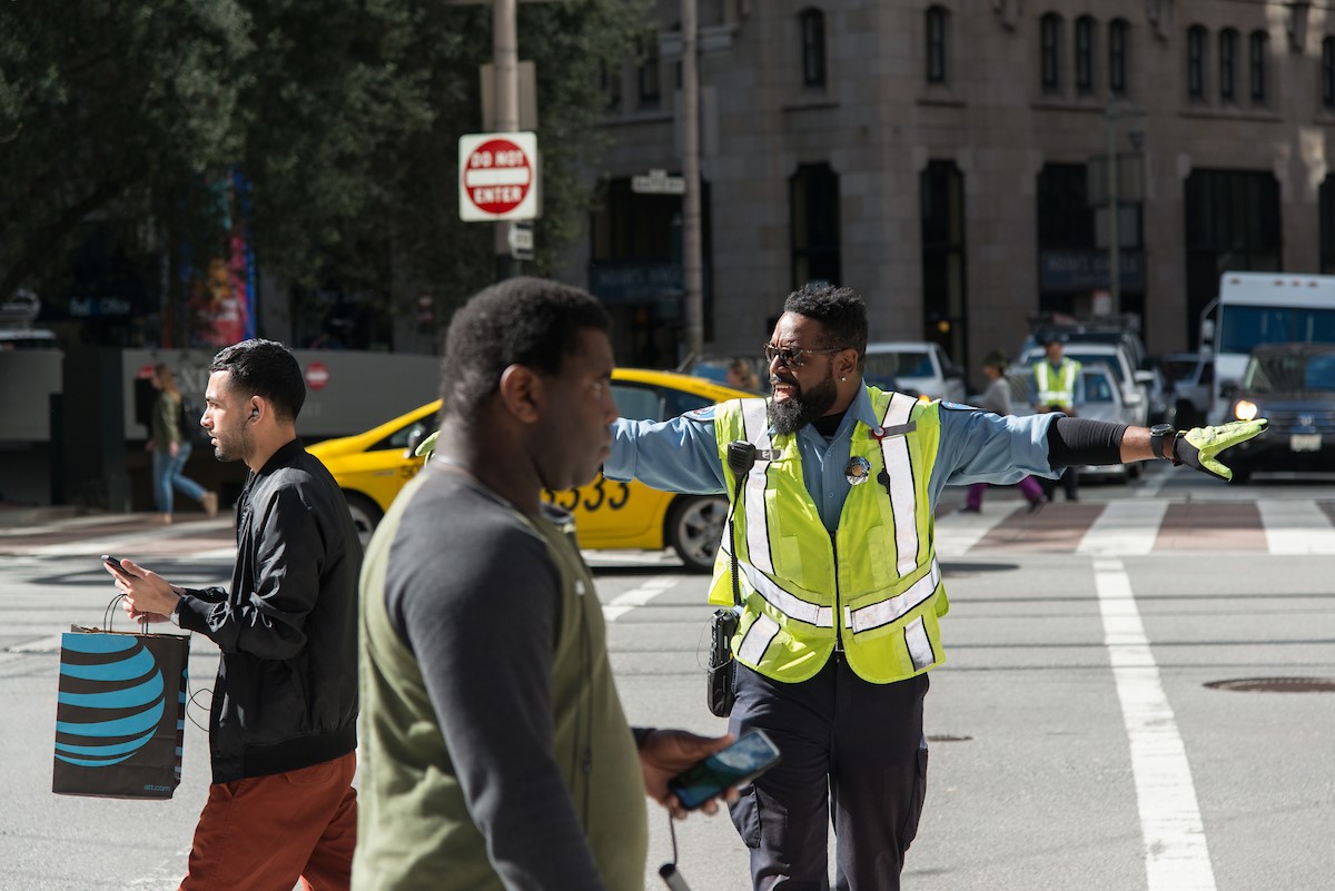 Parking Control Officer Larrell Dean directing traffic in 2019