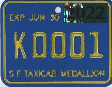 Post-K medallions has a blue plate with yellow embossed lettering and will have “K” prefix.  