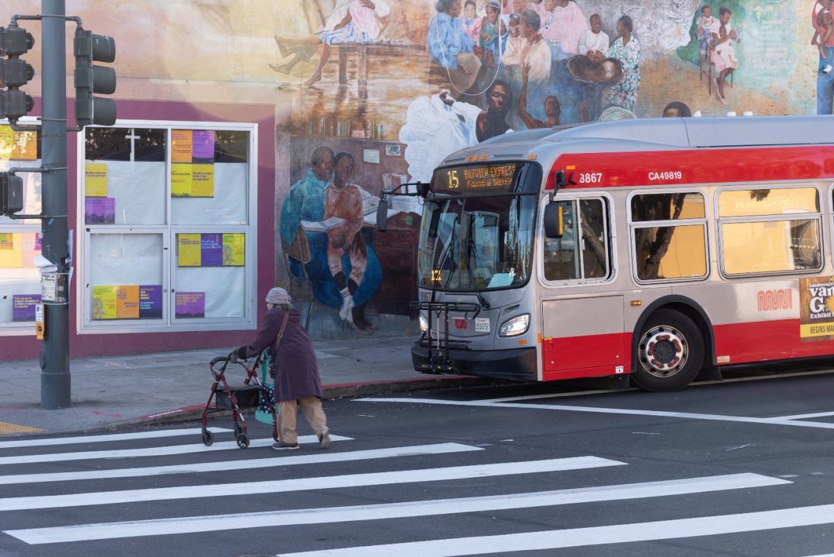 The 15 Bayview Hunters Point Express waits for person crossing the street