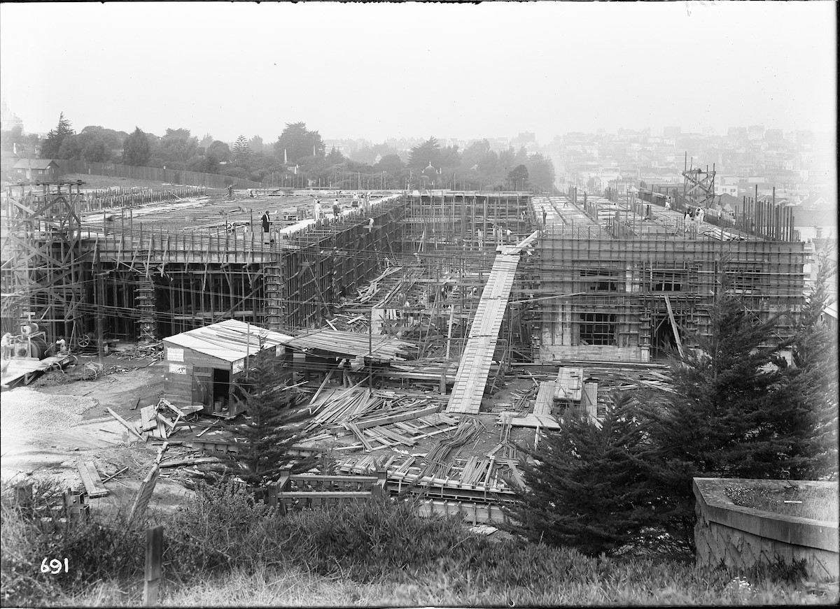 In-progress construction of Muni’s headquarters in October 1912, two months prior to the opening of the city’s publicly owned streetcar line in December. This photo was taken from Calvary Cemetery, the present-day location of a shopping center.