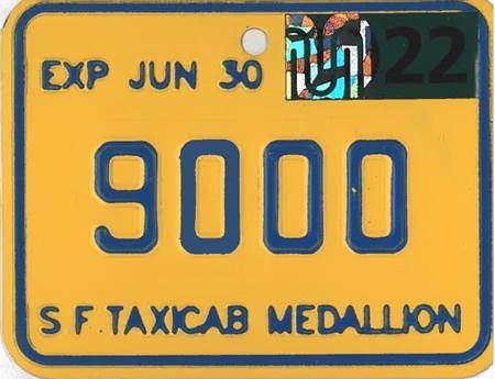 Ramp Taxi Medallions has a yellow plate with blue embossed lettering.