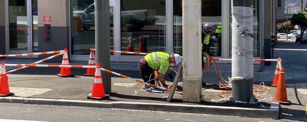 Crews installing traffic signal at southwest corner of Van Ness at Filbert.