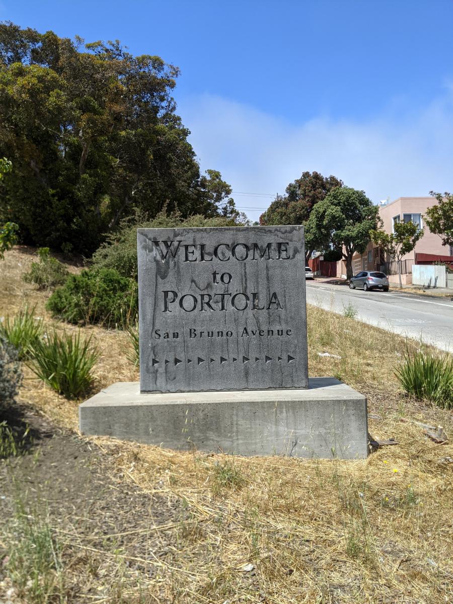welcome sign to Portola Neighborhood
