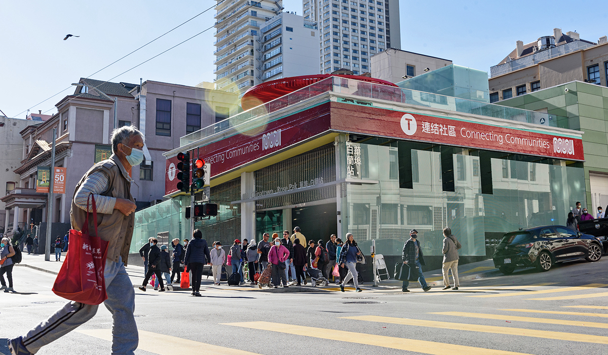 Outside view of Chinatown-Rose Pak station with crowds in Chinatown