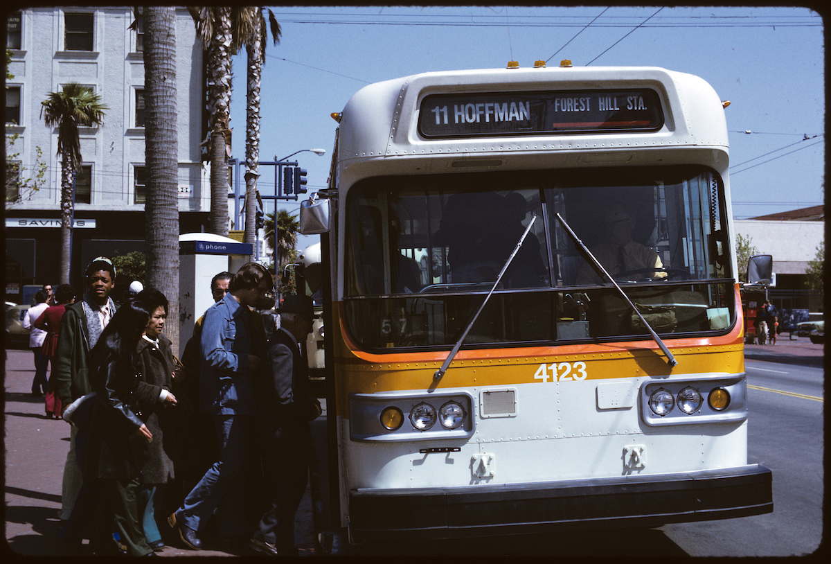 People boarding bus on Muni 11 Hoffman route.