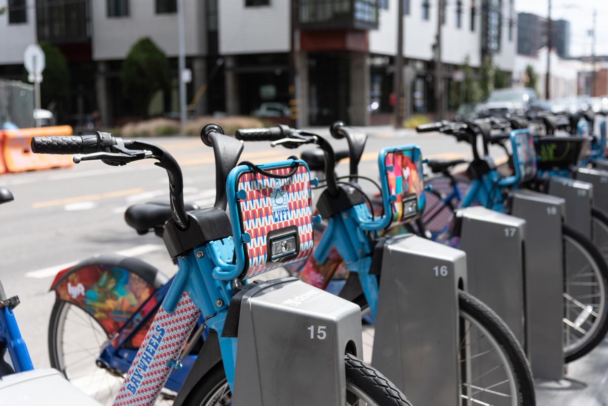 Photo showing e bikes lined up at a docking station