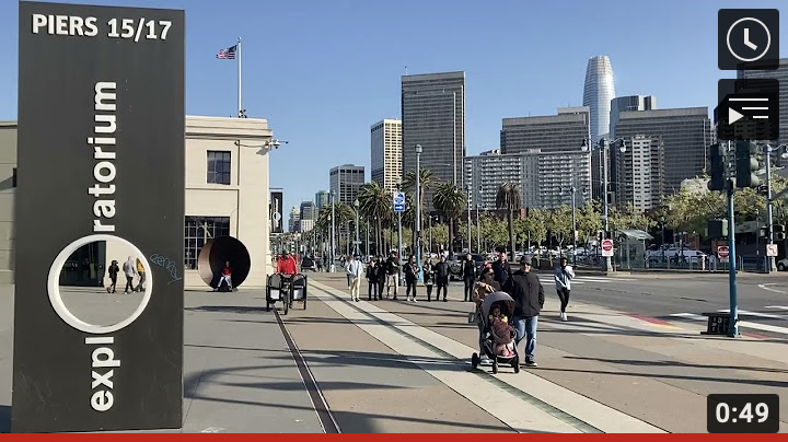 Image of the Embarcadero promenade at Piers 15/17 with the Exploratorium sign to the left