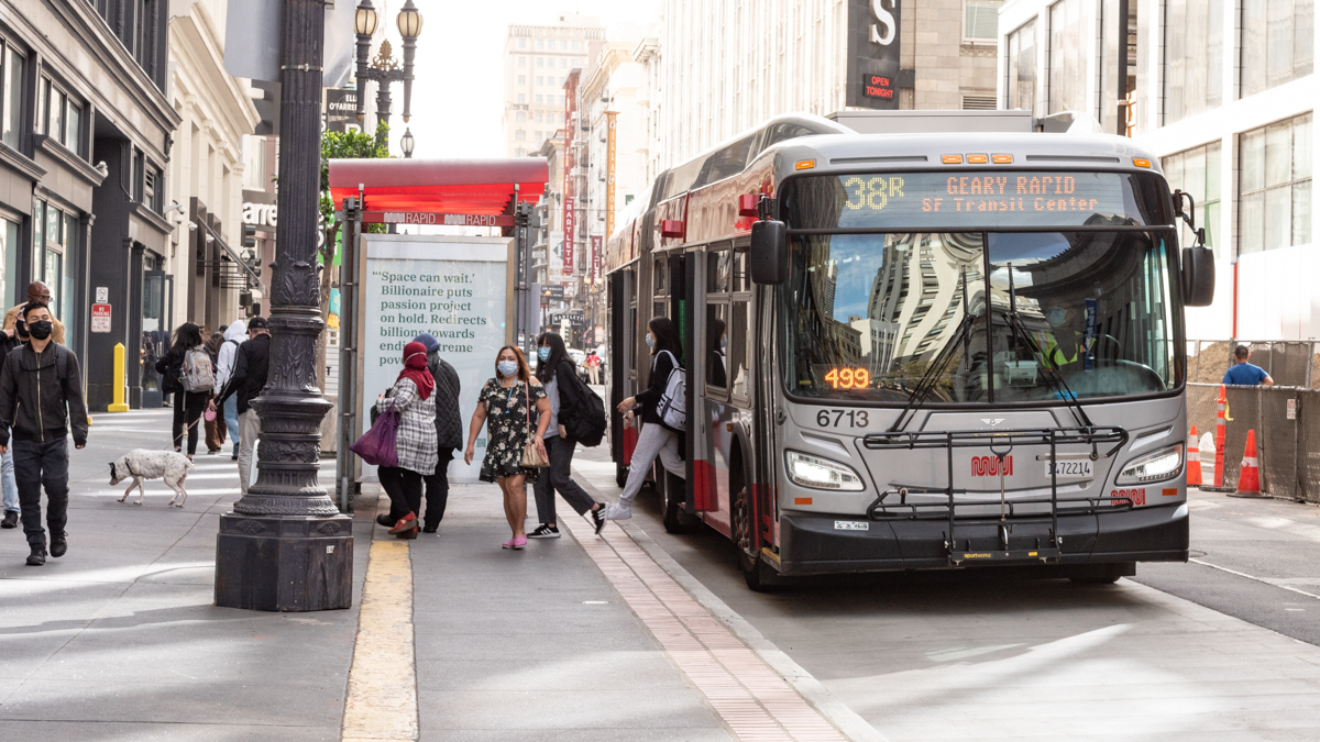 38R and Passengers at bus shelter downtown