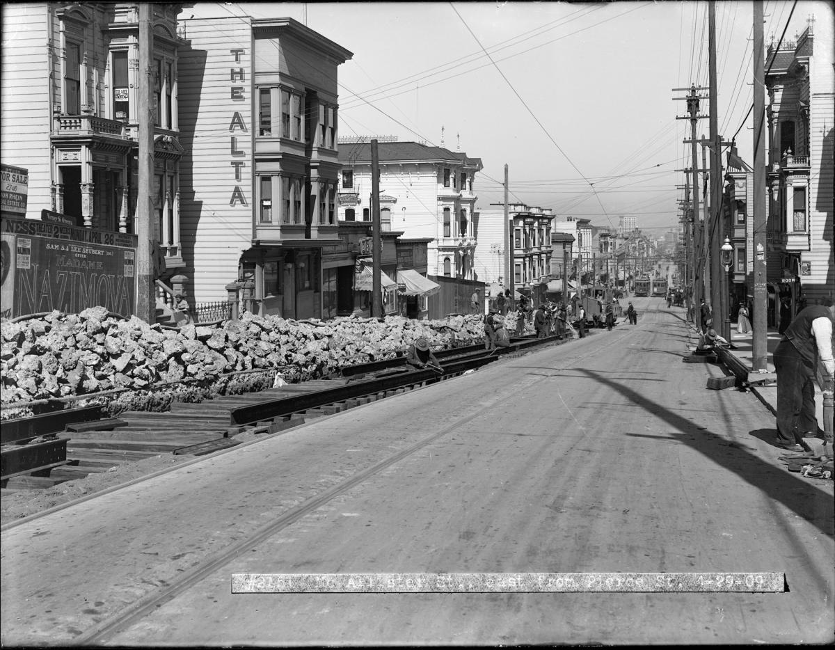 Workers install ties and rails to run the 5 McAllister Streetcar Line on McAllister and Pierce. 