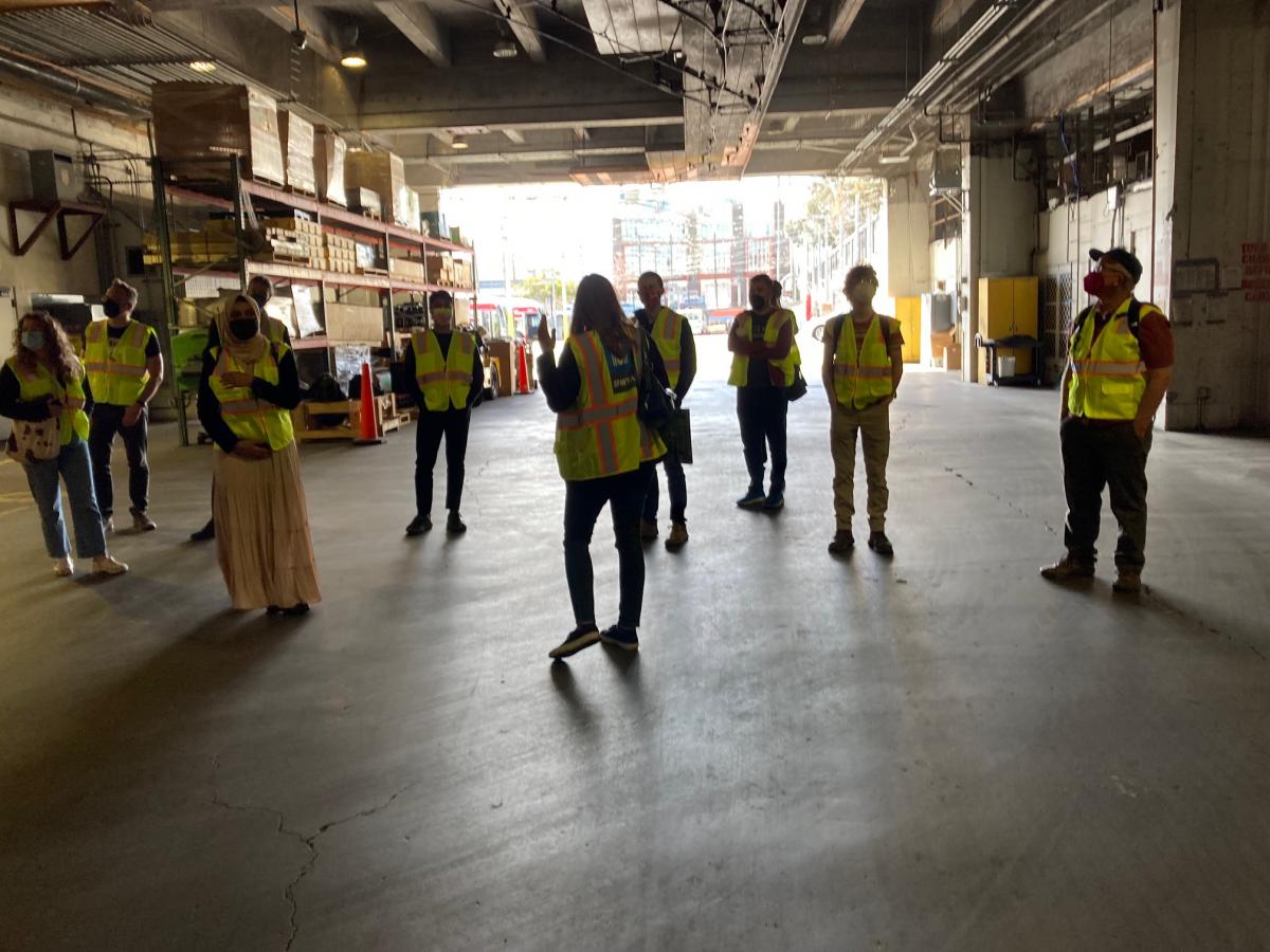 A group of people touring Potrero yard