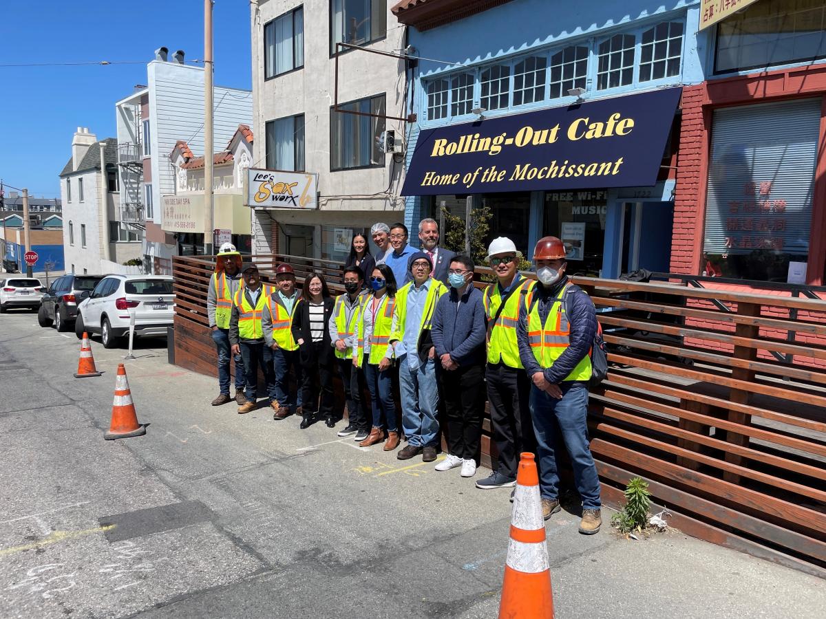 Group photo with NTK Construction, SFMTA project staff, MTA Board Director Sharon Lai, Owner of Rolling out Cafe, Supervisor Gordon Mar and MTA Director of Transportation Jeff Tumlin outside Rolling Out Cafe on Taraval and 26th after the Media Roundtable for L Taraval Improvement Project Segment B