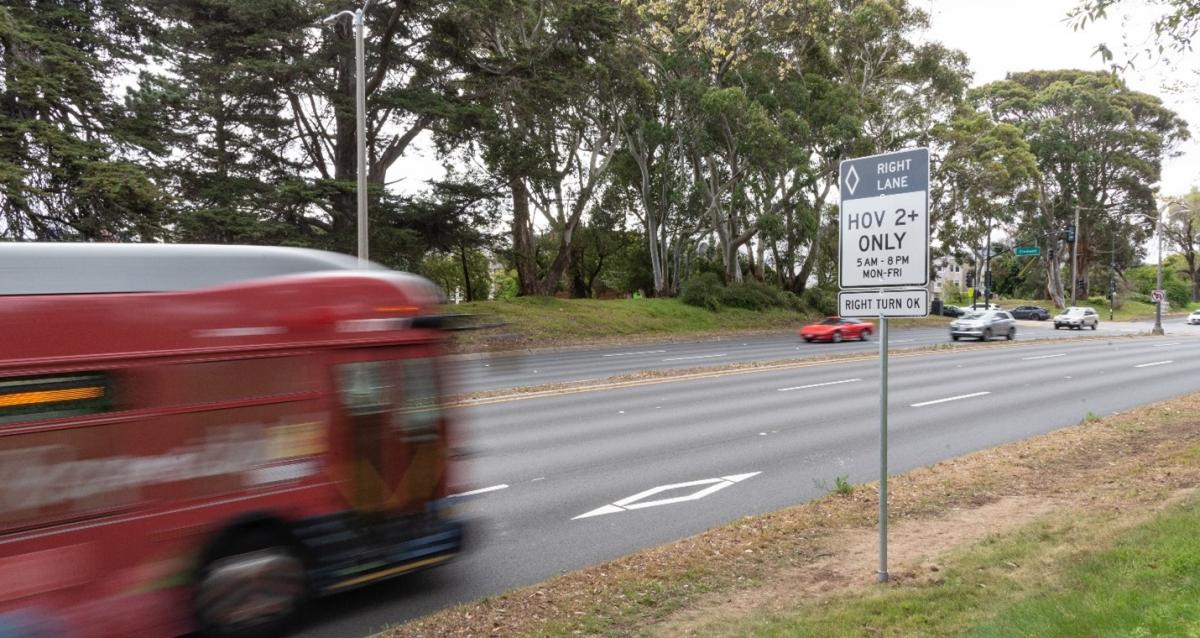 Photo of the new carpool lanes on Park Presidio Boulevard and the sign letting people know that the right lane is an HOV lane for two or more passengers.