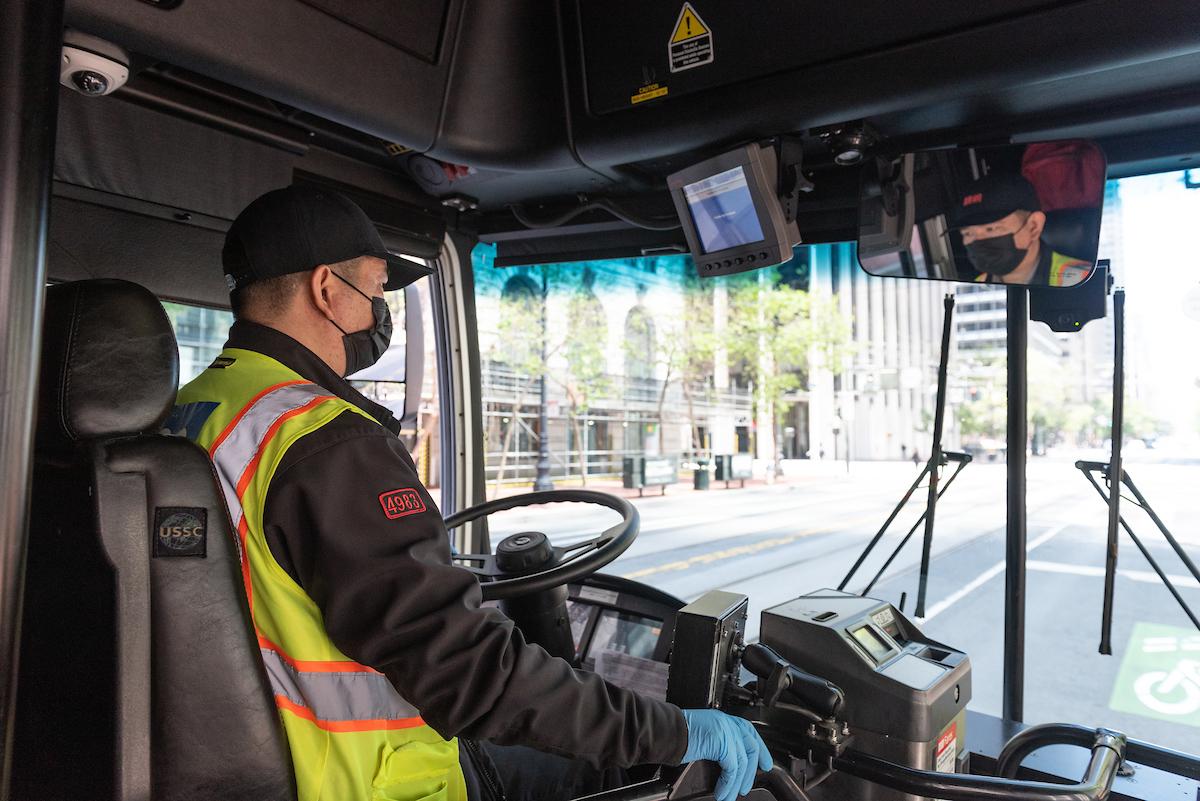 Photo of a bus operator wearing a mask