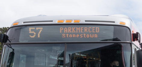 Destination sign on the outside of a bus showing the 57 Parkmerced to Stonestown