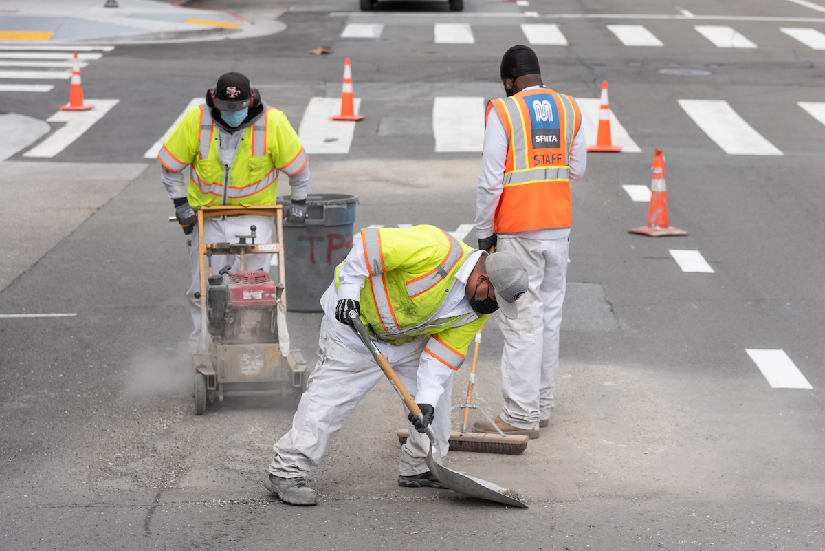 Photo of SFMTA crews prepping the road for striping changes