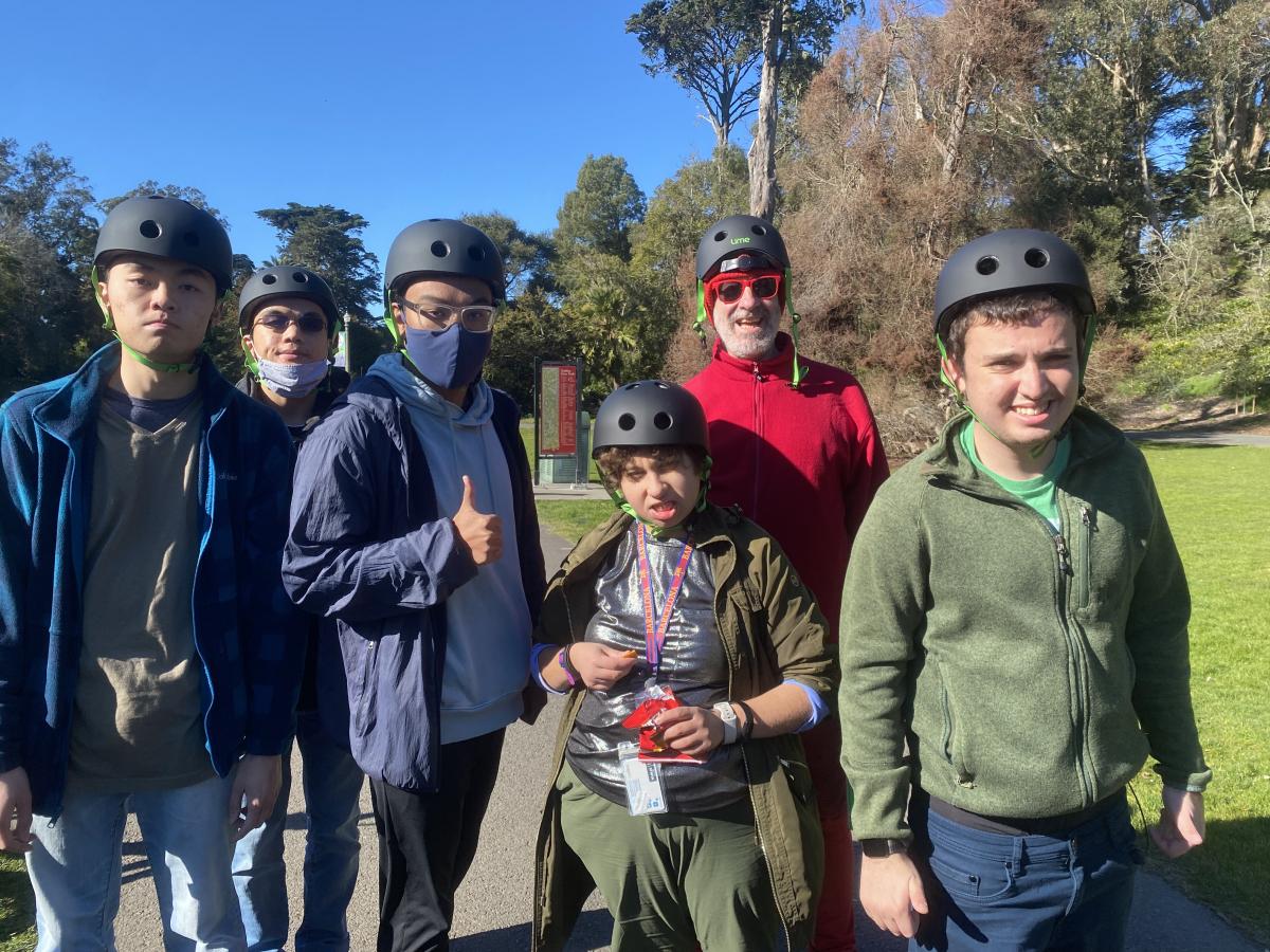 A group of AccessSFUSD students wearing helmets