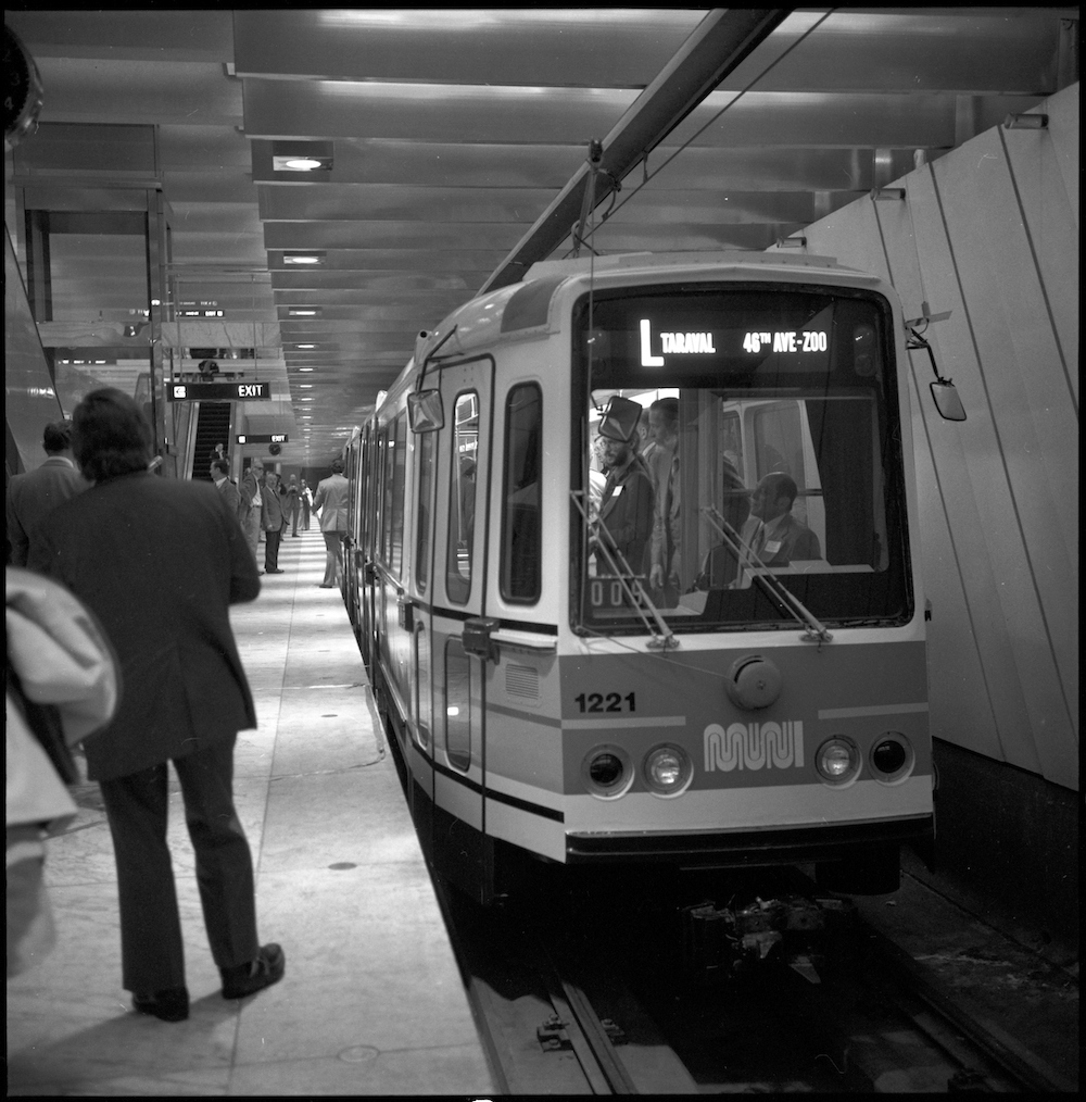 black and white image of Muni LRV on L Taraval Line waiting at platform inside Embarcadero Station