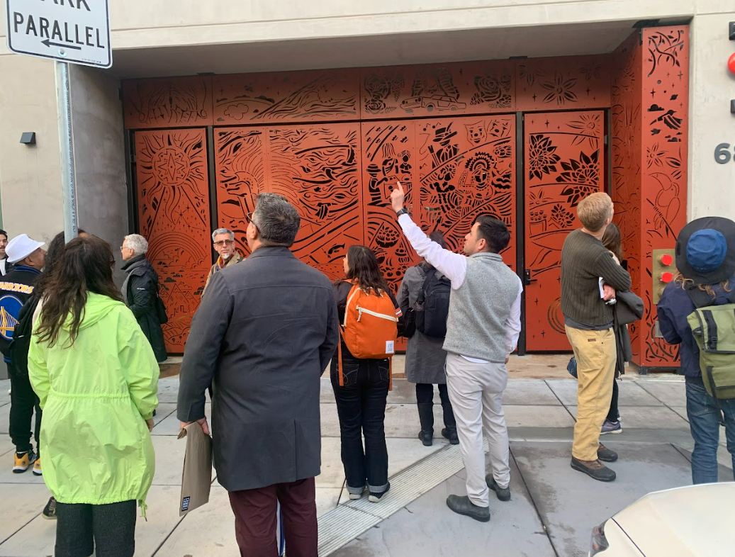 people looking at a building's exterio