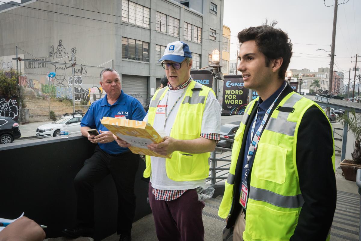 SFMTA Staff preparing community members for an in-person tour of the bus yard with translators and support