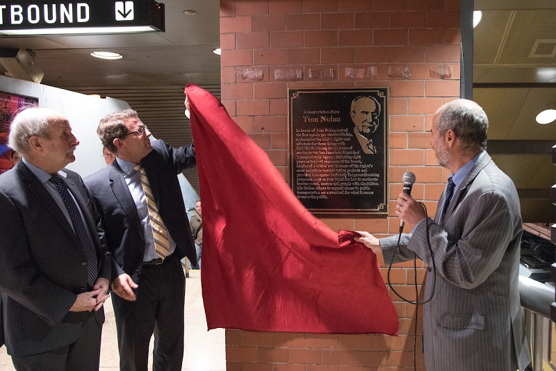 Tom Nolan and Ed Reiskin removing red curtain from plaque