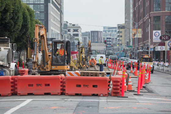 An escavator prepares the<br />
    roadway on 4th Street between Brannan and Townsend streets for sewer upgrades.