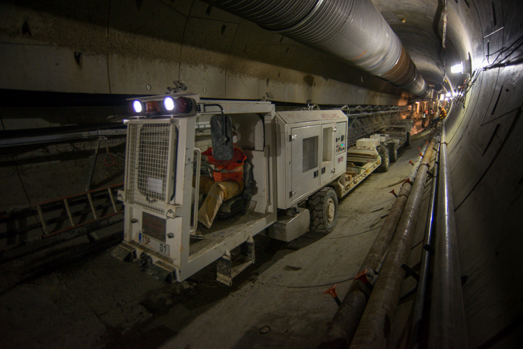 This cart brings materials in and out of the new tunnel, where TBM Mom Chung continues digging.