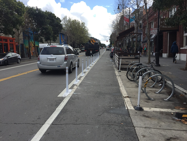 Valencia at 18th Street with new one-foot buffer and flex-posts