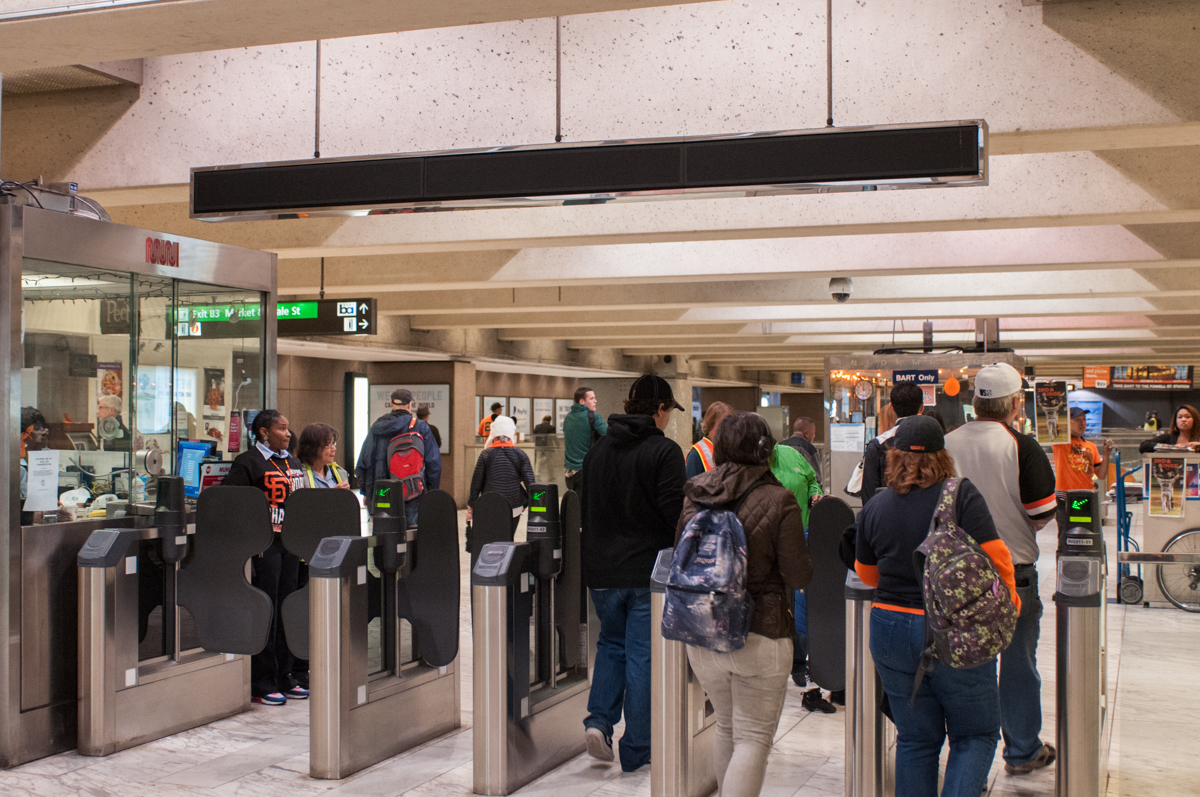 Fans and commuters file into Embarcadero Station. 