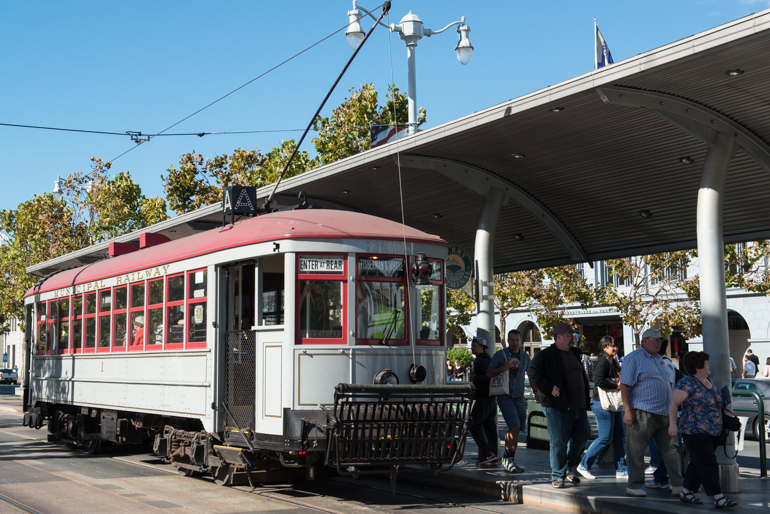 Muni Streetcar 1 unloading passengers at ferry plaza stop on E-Embarcadero Line, September 26, 2015