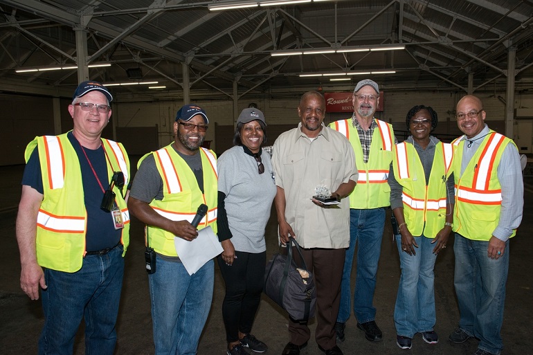 Muni staff stand with roadeo winner, Kevin Grady.