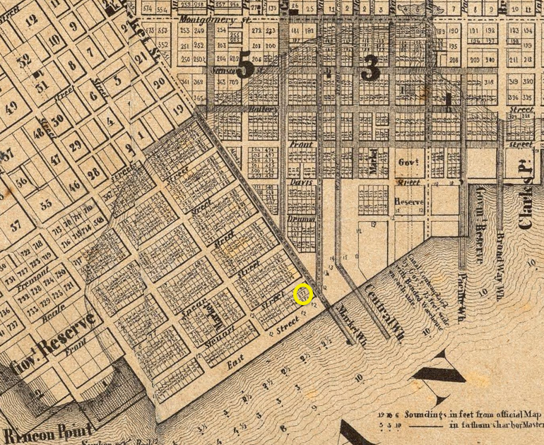 Detail of a historic 1852 map showing the street layout in downtown San Francisco, focused on the eastern end of Market Street, at present-day Market and The Embarcadero. The map includes a line indicating the original eastern coastline, roughly along Montgomery and 2nd streets.