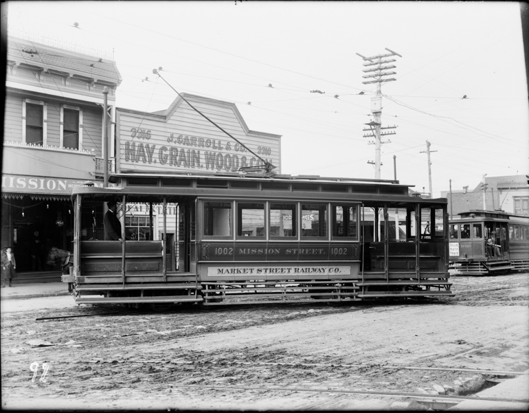 Side view of electric streetcar turning onto 29th street from mission street taken January 1904
