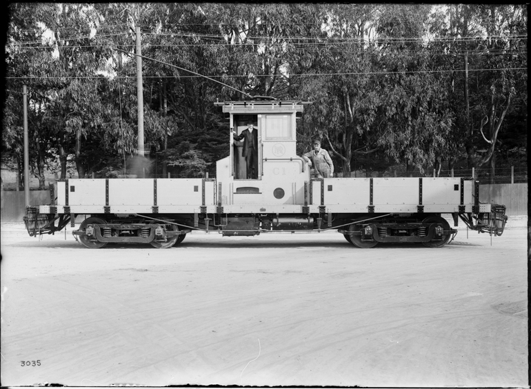 Side view of Muni work streetcar C-1, a flat car with a central control booth.  Taken March 17, 1916