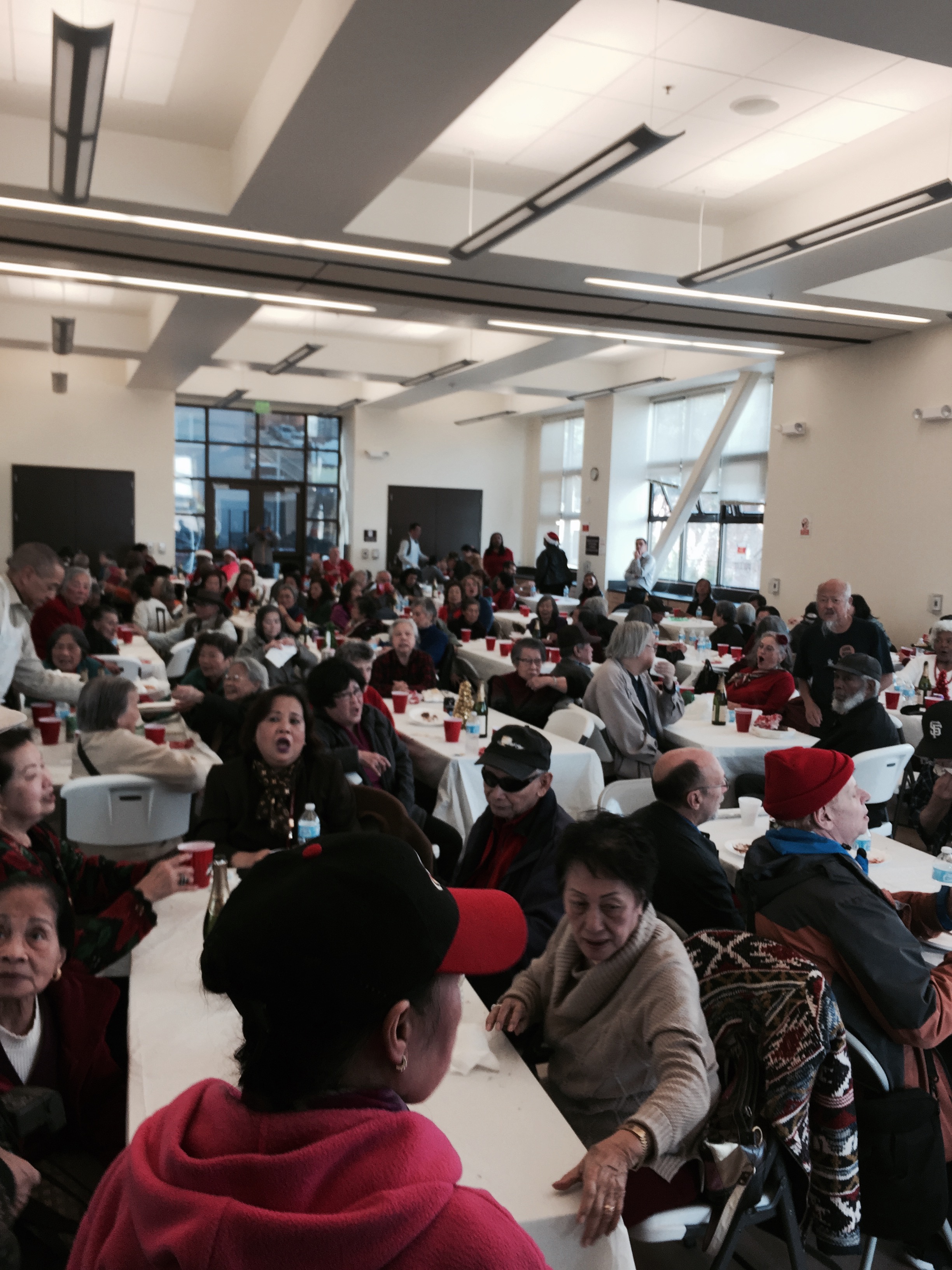 Seniors gathered for Cable Car lunch are served in a festive banquet room