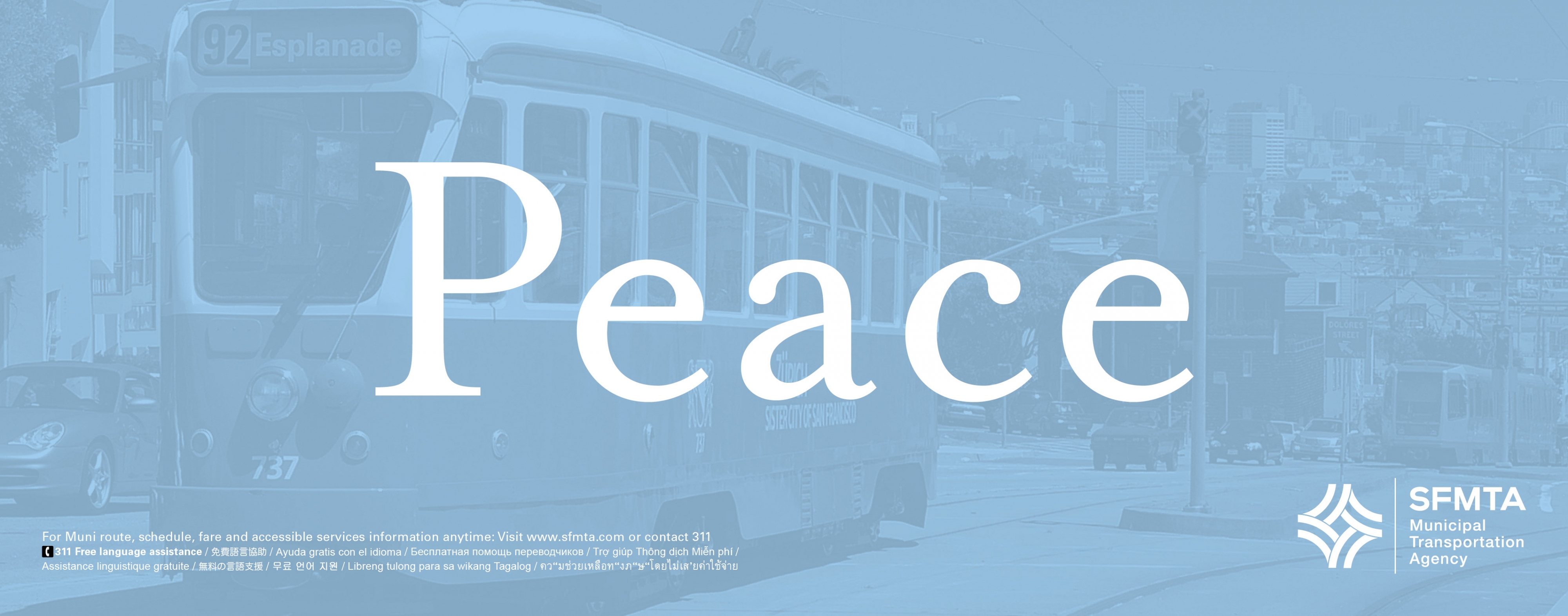 "Peace" in white text on a background of a light blue-tinted photograph of a Muni historic streetcar.