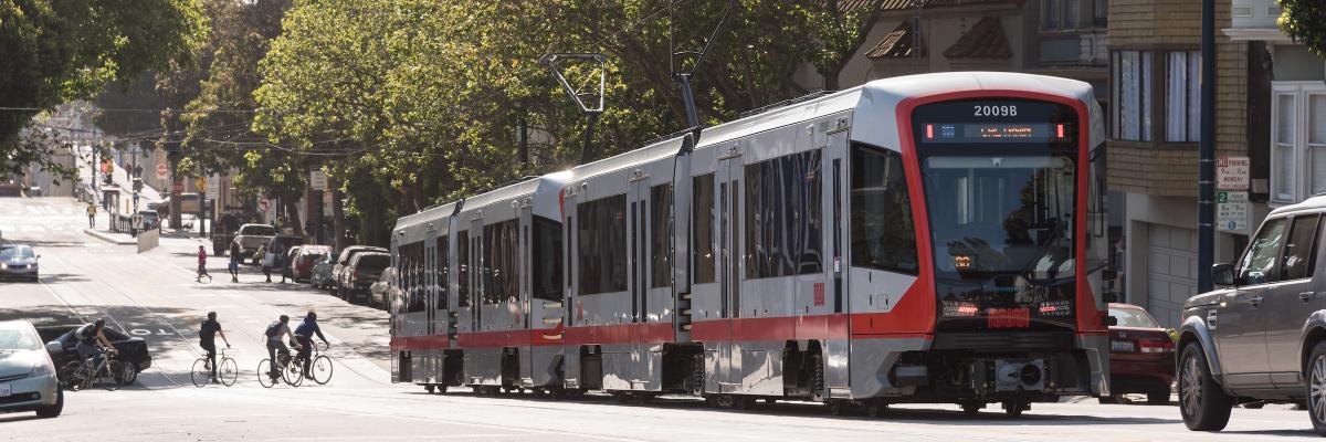 Light Rail Vehicle traveling through Neighborhood