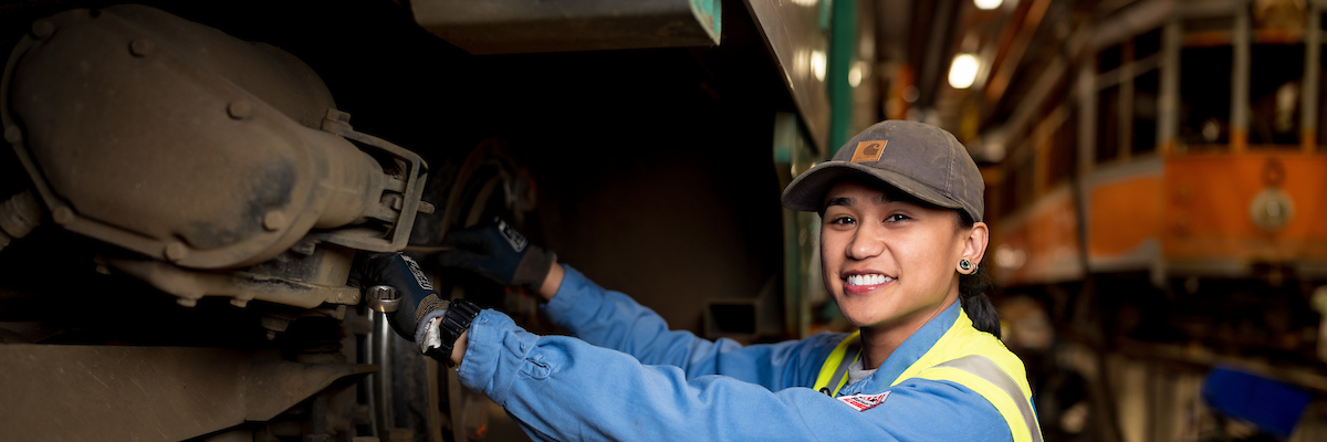 Jeena Villamor checks resistance on the contactors for an accelerator drum at the SFMTA.