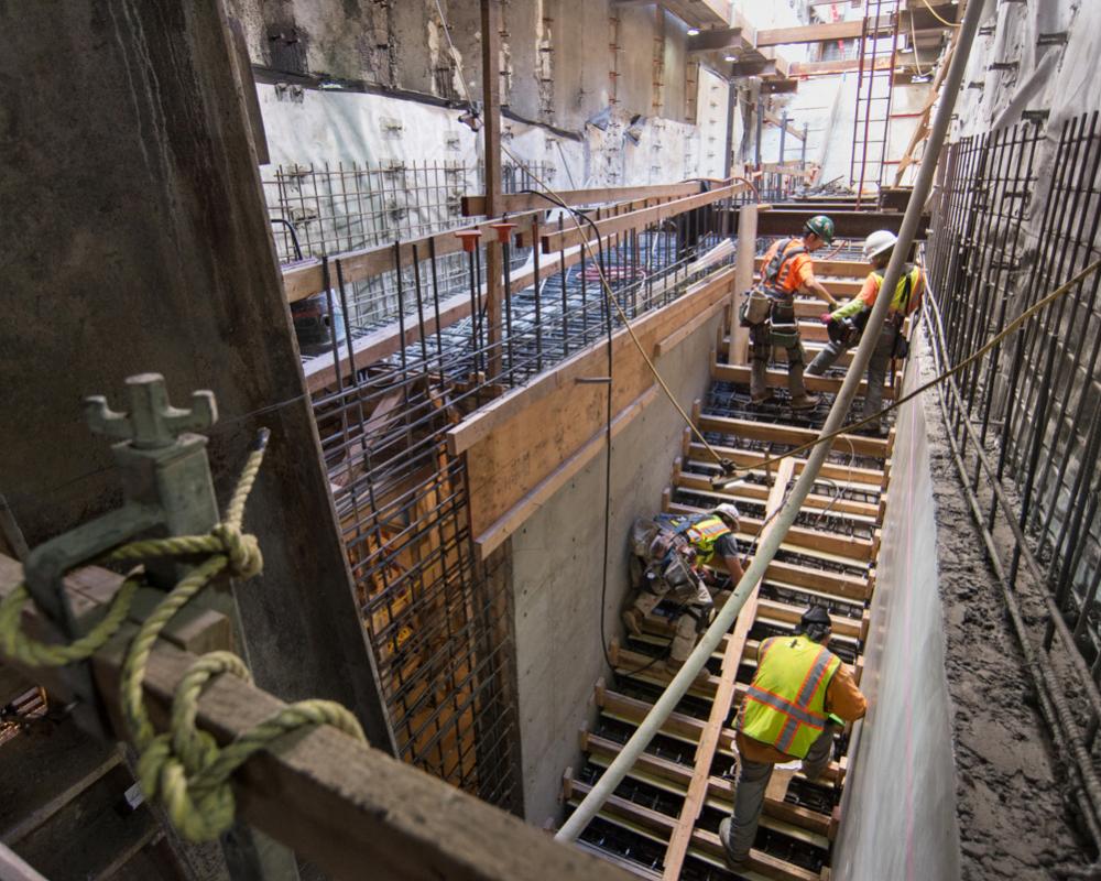 Concrete forms are constructed for future emergency egress stairs on the east side of Stockton at O'Farrell.