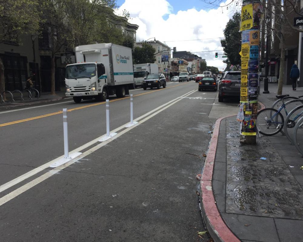Flex posts and paints installed on Valencia Street next to bulb-out