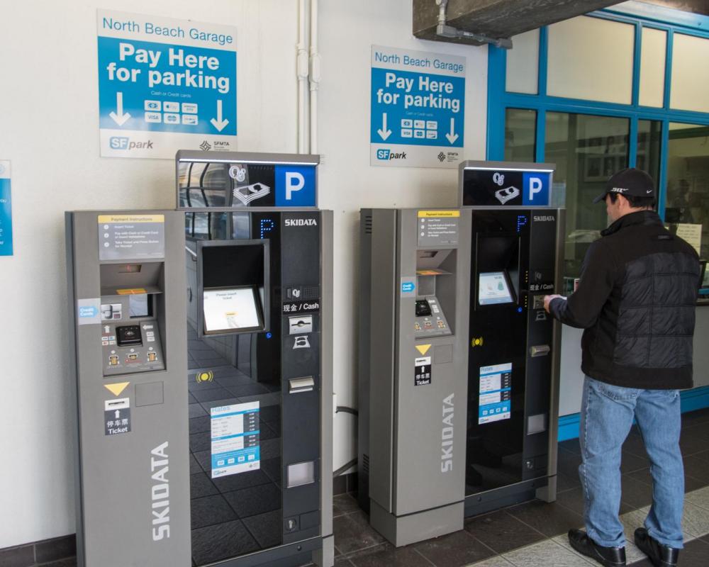 Customer Using New PARCS Payment Equipment at North Beach Parking Garage