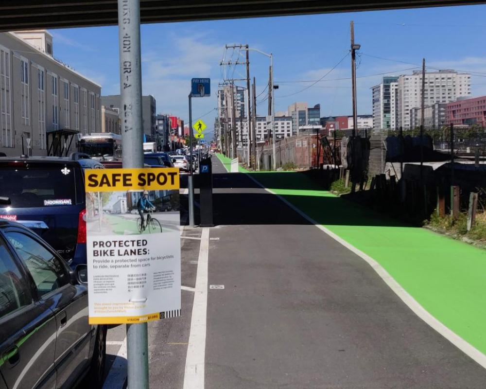 Photo of freshly paved green protected bikeway between 5th and 7th streets - June 2019