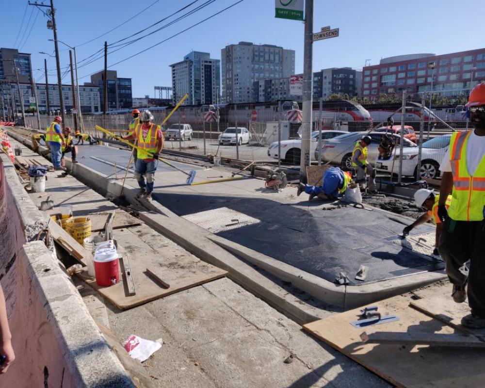 Photo of crews building the sidewalk boarding island at 5th Street - October 2019