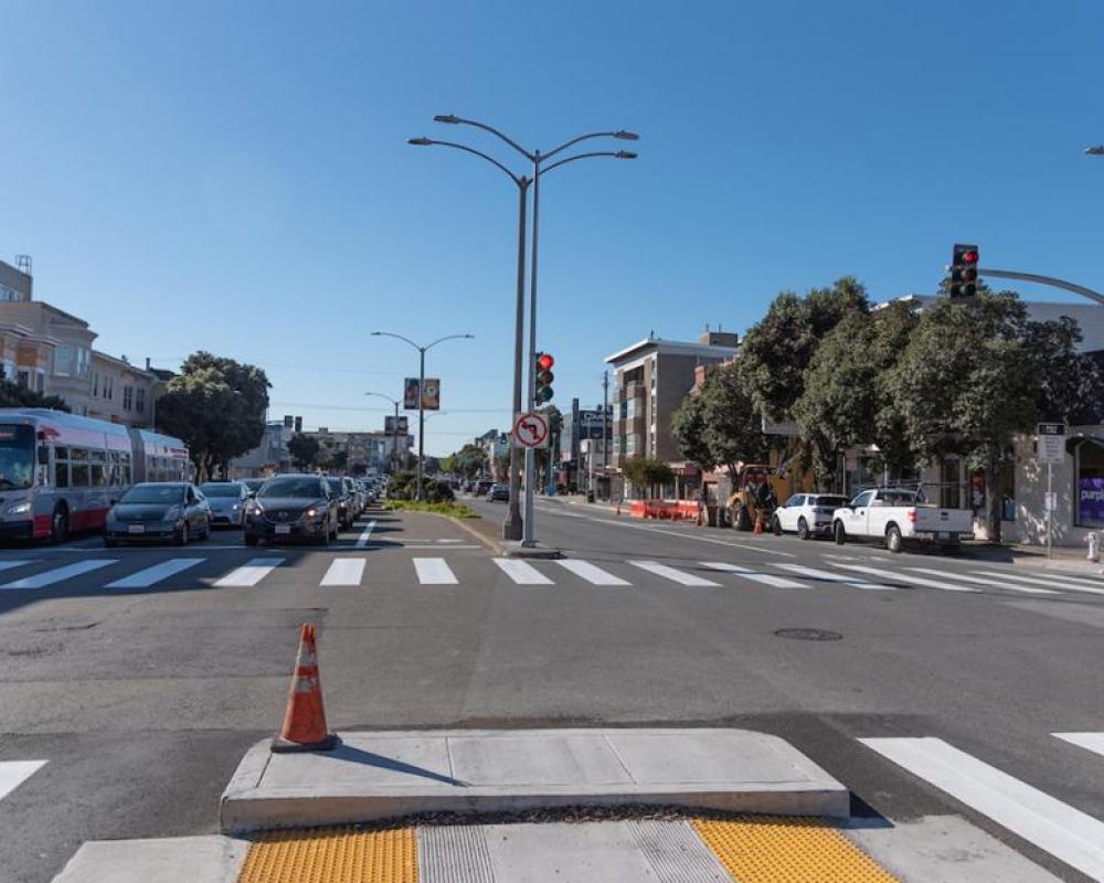 Image of cars stopped at new traffic signal at Cook Street