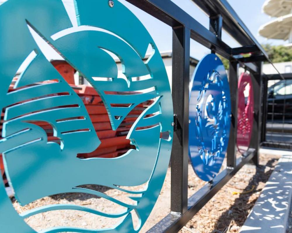 Photo showing three round decorative panels depicting St. Francis Square, the Fillmore and Japantown