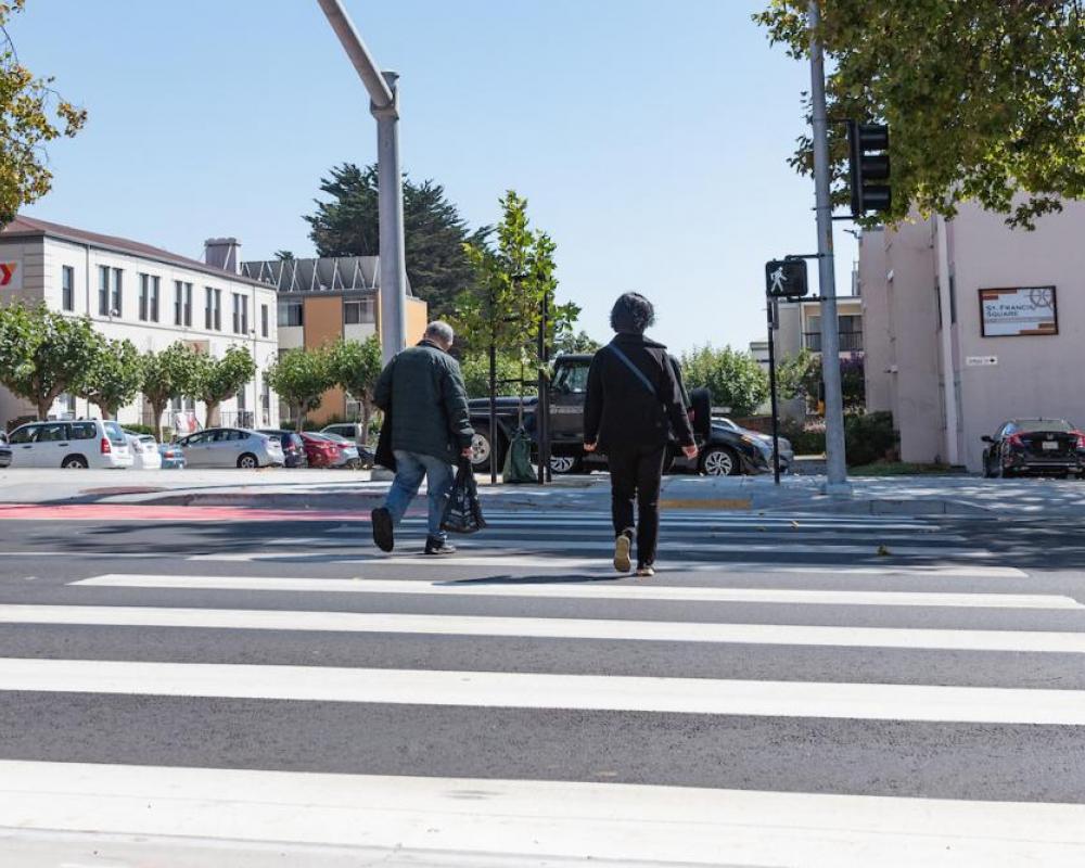 Photo of people walking across the new crosswalk