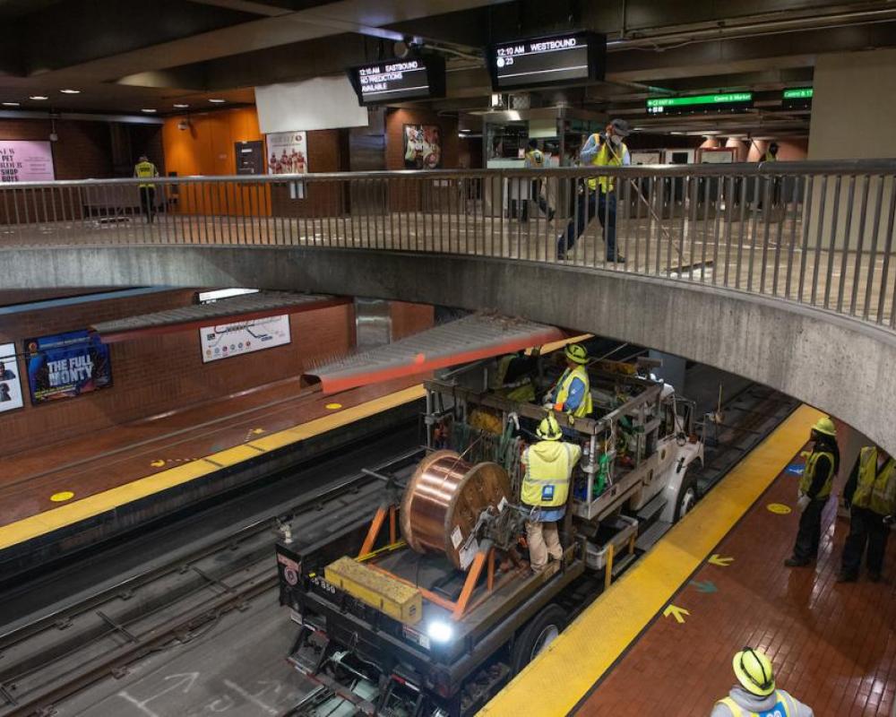 MOW crews install new wires while custodians complete a deep clean of the Mezzanine at Castro Station