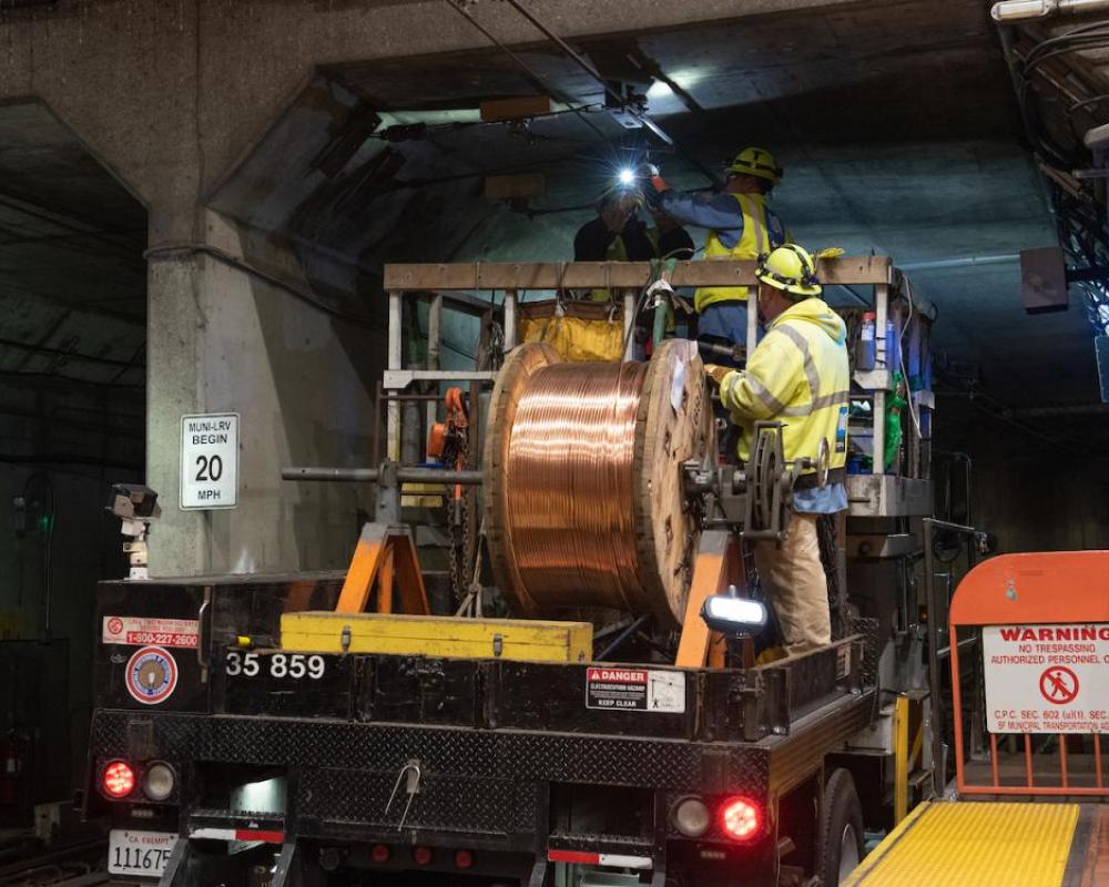 SFMTA Line workers pull new overhead cables at Castro Station during Fix It Week